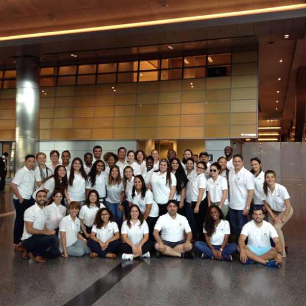 Group Photo of Students in white Polos