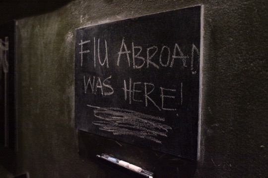 A chalkboard with "FIU Abroad was here" written on it.