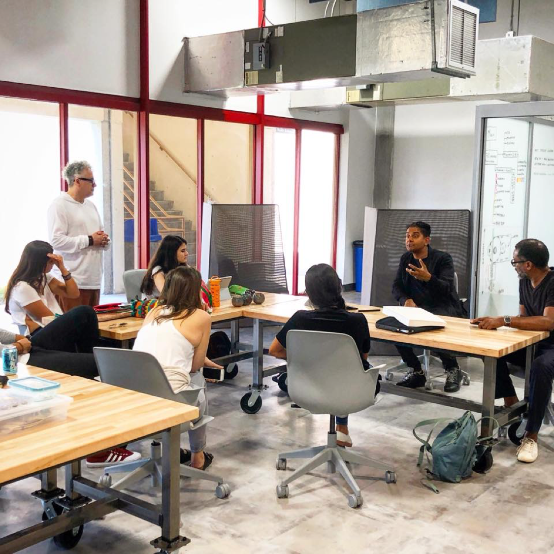 Students listening to a lecture in the art + design incubator