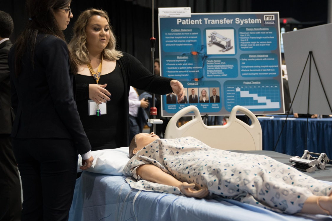 Mechanical and Material Engineer Student showing medical equipment in FIU arena